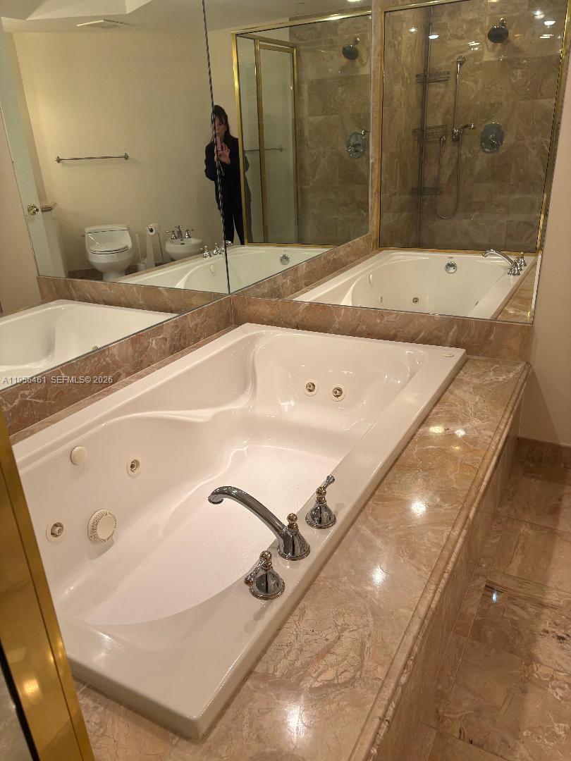 9595 Collins Avenue, Unit N9I Surfside, FL 33154 - Photo 3 of 9 a bathroom with a tub and a sink