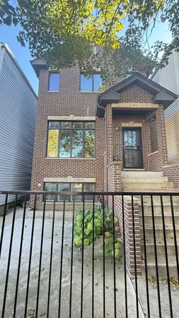 a view of a house with a small yard