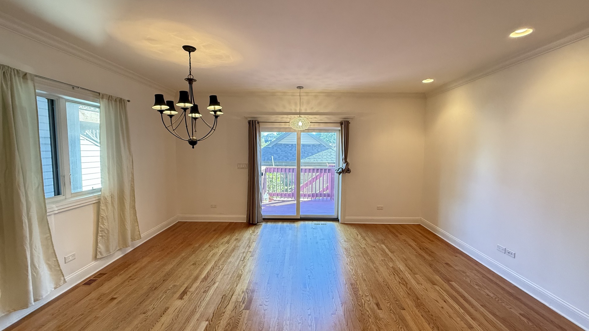 4411 South Wallace Street Chicago, IL 60609 - Photo 11 of 23 a view of empty room with wooden floor and fan