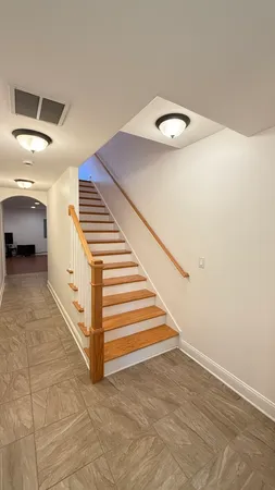 a view of a hallway with staircase