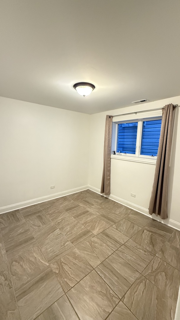 4411 South Wallace Street Chicago, IL 60609 - Photo 21 of 23 a view of an empty room