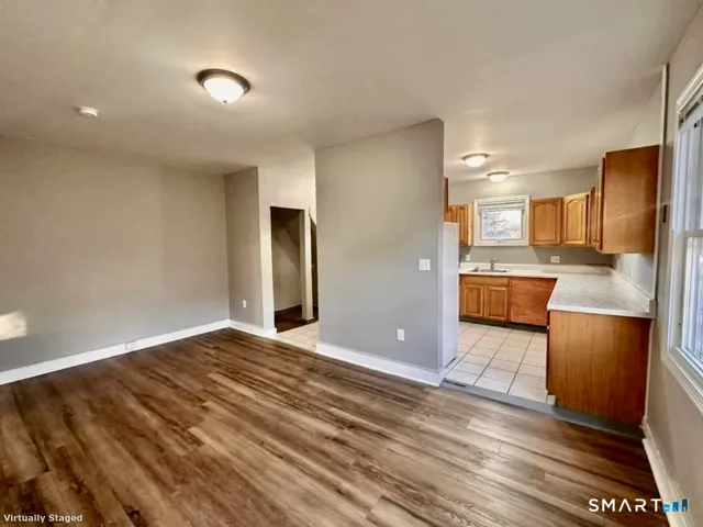 a view of kitchen with wooden floor
