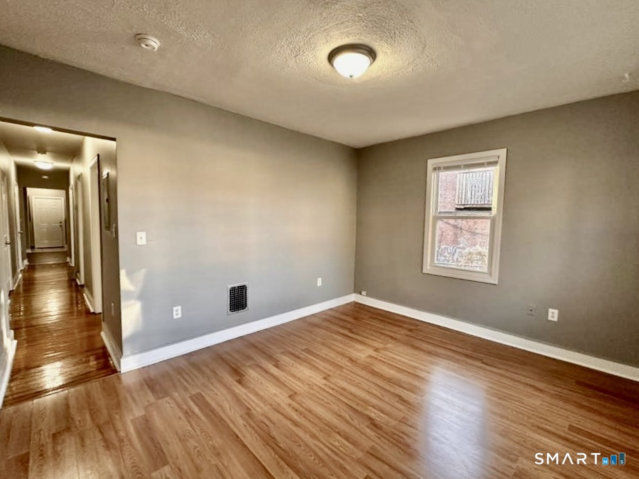 786 George Street New Haven, CT 06511 - Photo 22 of 28 wooden floor in an empty room with a window