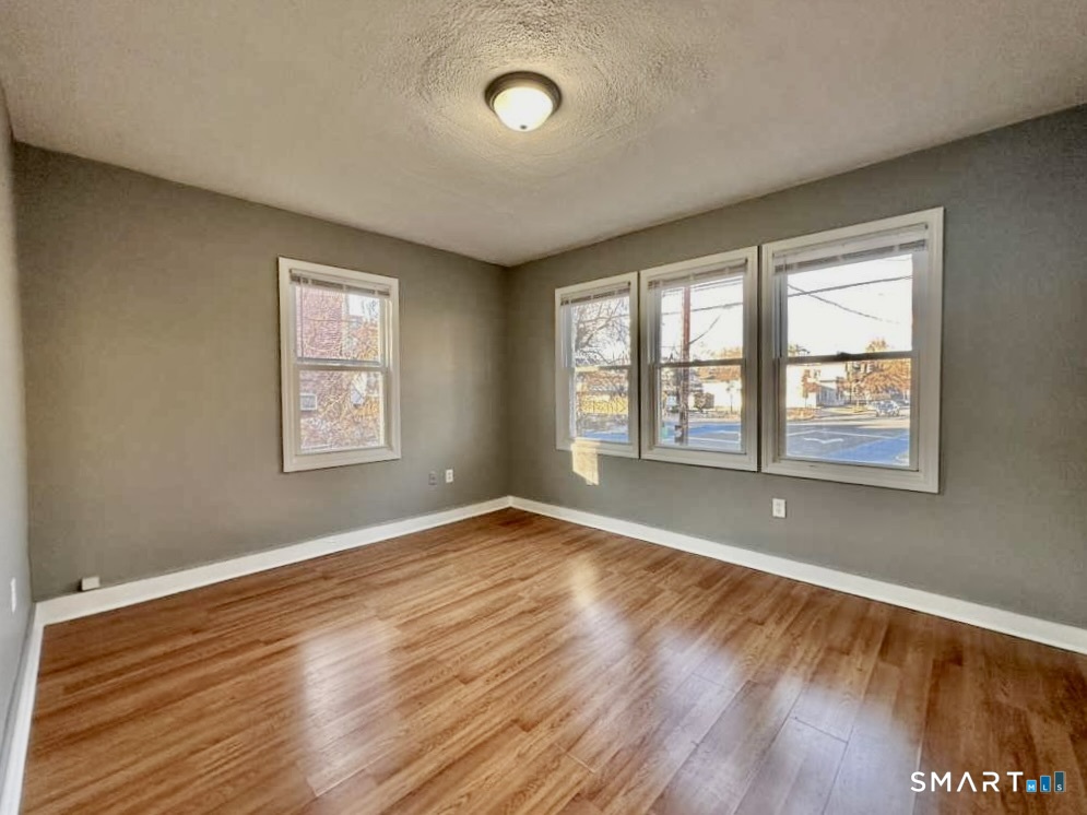 786 George Street New Haven, CT 06511 - Photo 24 of 28 an empty room with wooden floor and windows