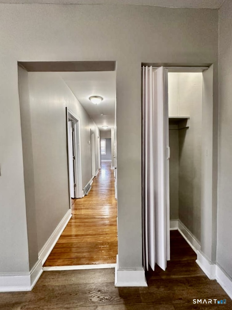 786 George Street New Haven, CT 06511 - Photo 26 of 28 a view of a hallway with wooden floor and staircase