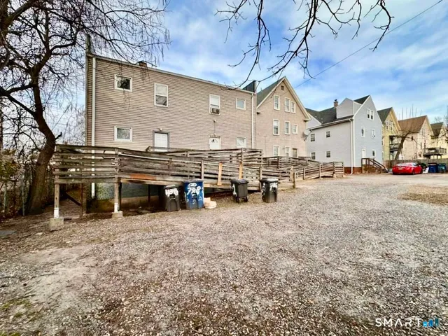 a view of a house with a snow on the road