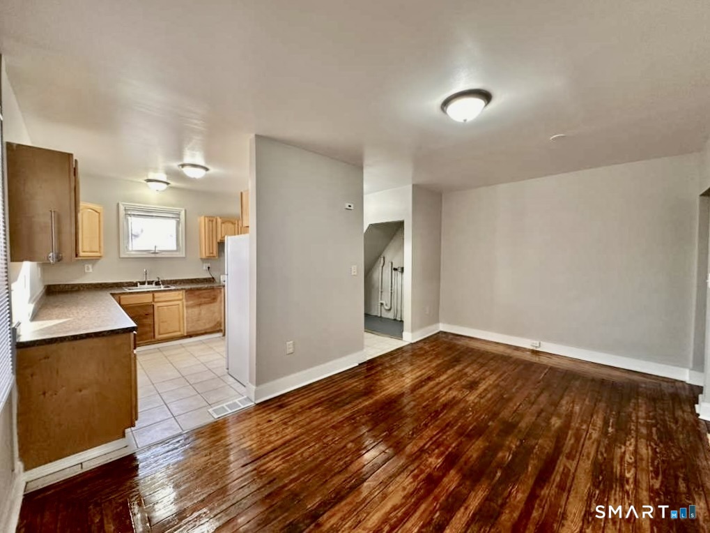 786 George Street New Haven, CT 06511 - Photo 5 of 28 a view of a kitchen with wooden floor and a sink