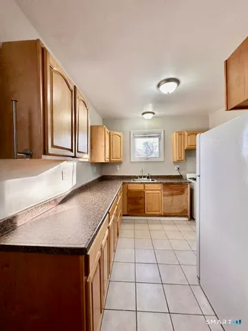 a kitchen with stainless steel appliances granite countertop a sink and cabinets