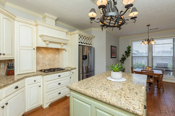 a kitchen with sink and cabinets