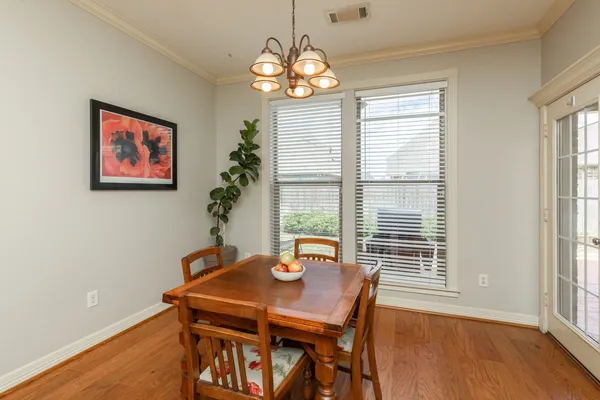a view of a dining room with furniture and window