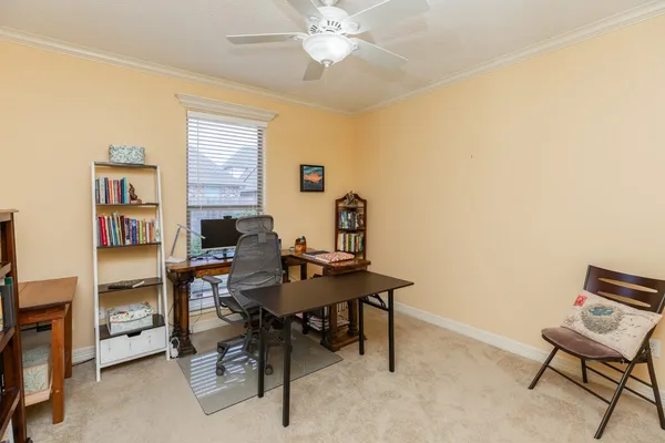 a view of a workspace with furniture