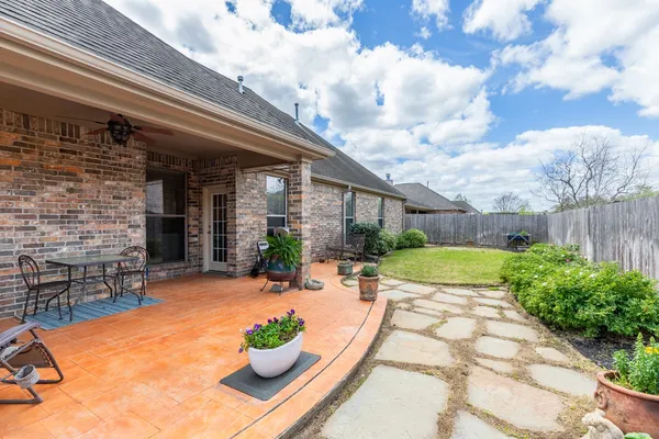 a view of a backyard with sitting area