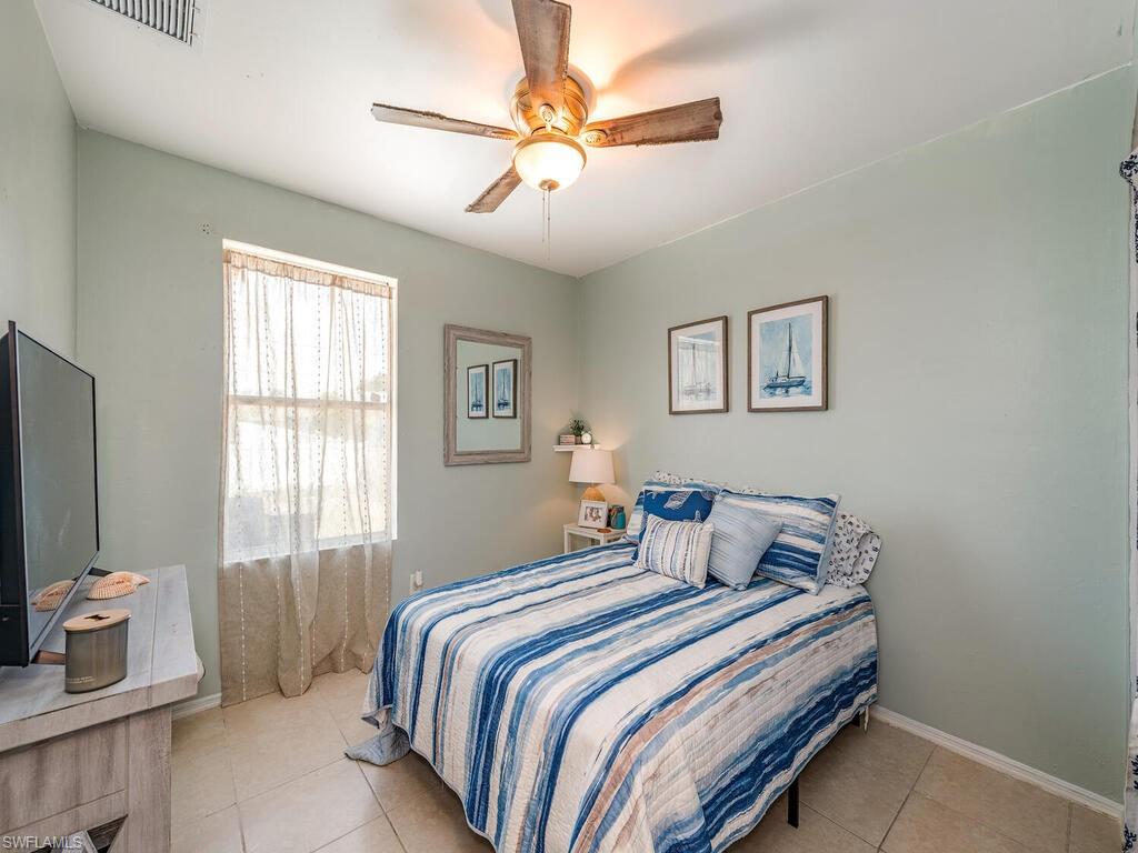 18351 Camellia Road Fort Myers, FL 33967 - Photo 11 of 11 a bedroom with a bed and a window