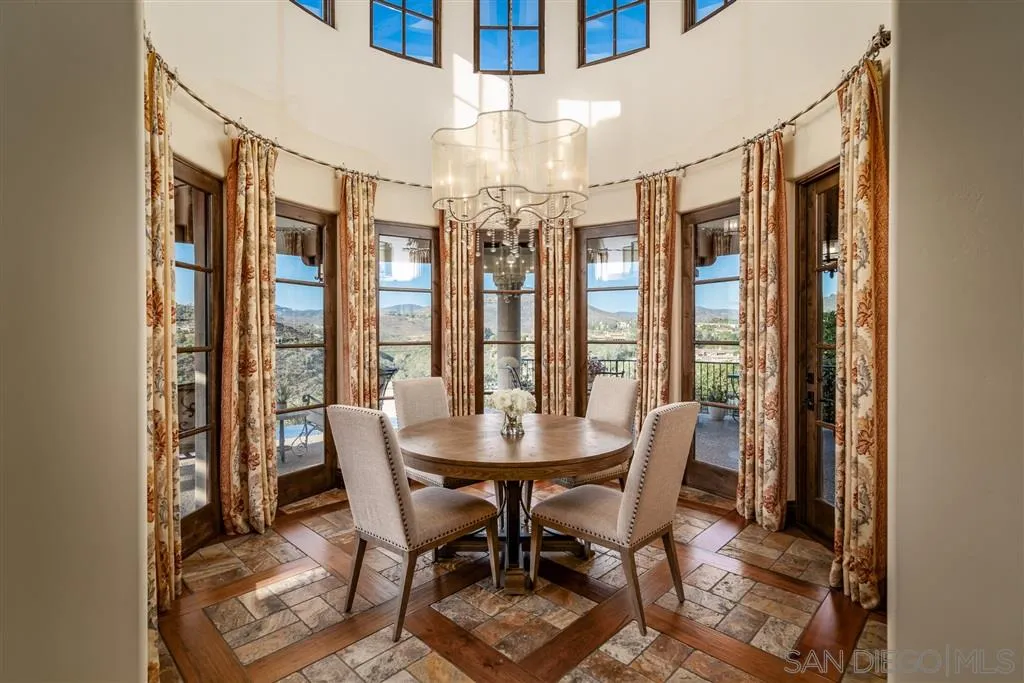 6266 Strada Fragante Rancho Santa Fe, CA 92091 - Photo 13 of 25 a view of a dining room with furniture and chandelier