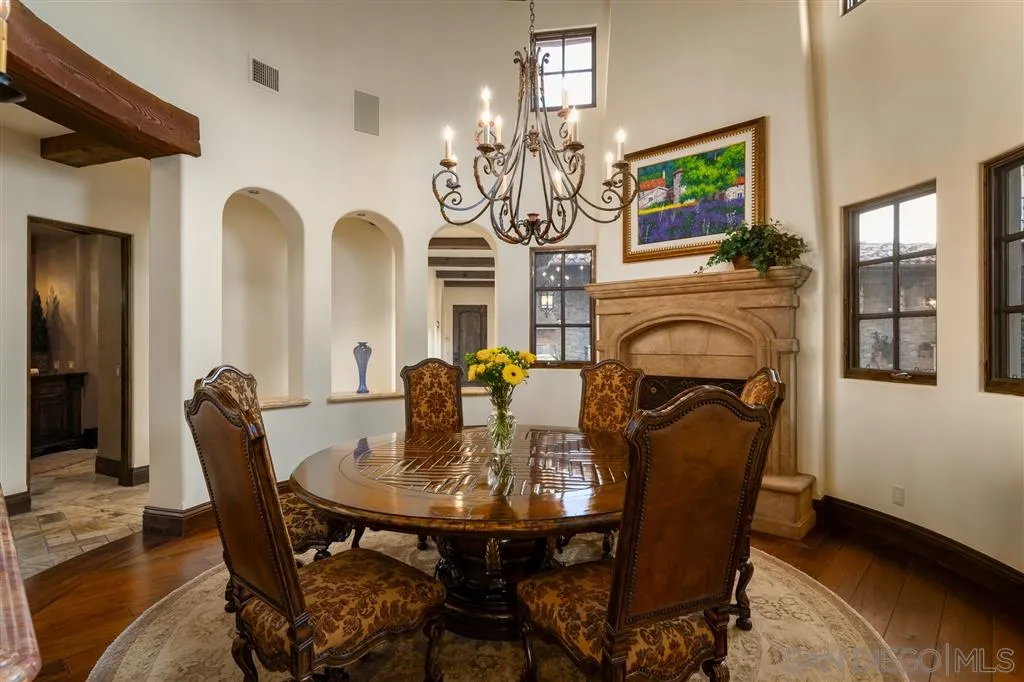 6266 Strada Fragante Rancho Santa Fe, CA 92091 - Photo 15 of 25 a view of a dining room with furniture and chandelier