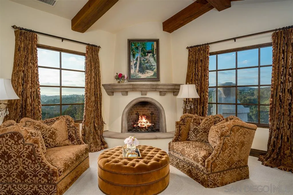 6266 Strada Fragante Rancho Santa Fe, CA 92091 - Photo 18 of 25 a living room with furniture a fireplace and a large window