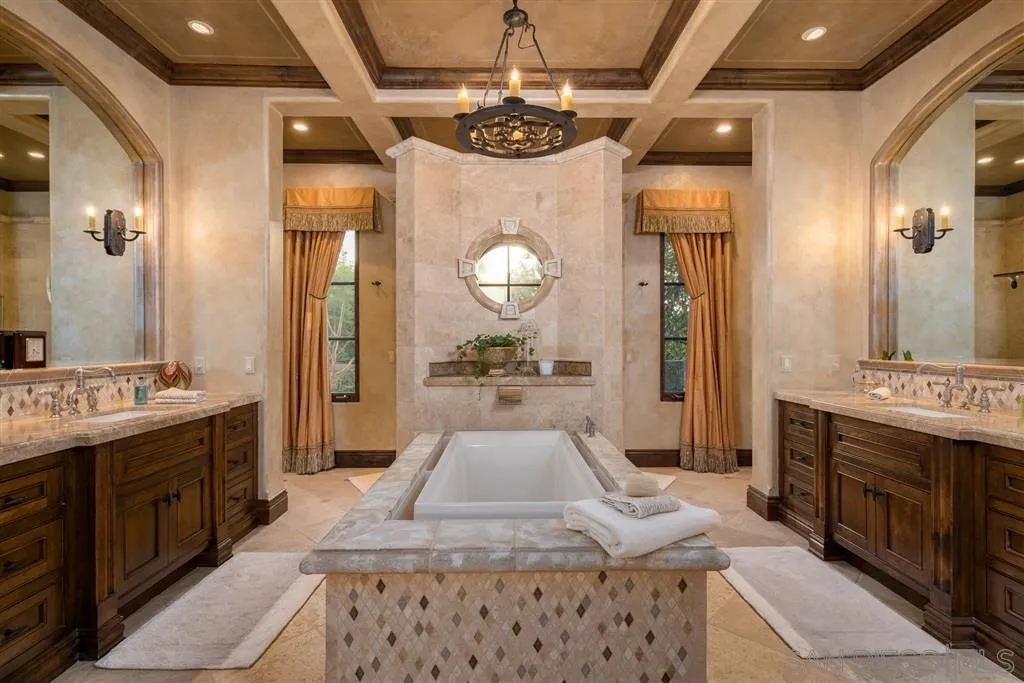 6266 Strada Fragante Rancho Santa Fe, CA 92091 - Photo 19 of 25 a large bathroom with a sink a large mirror and a shower