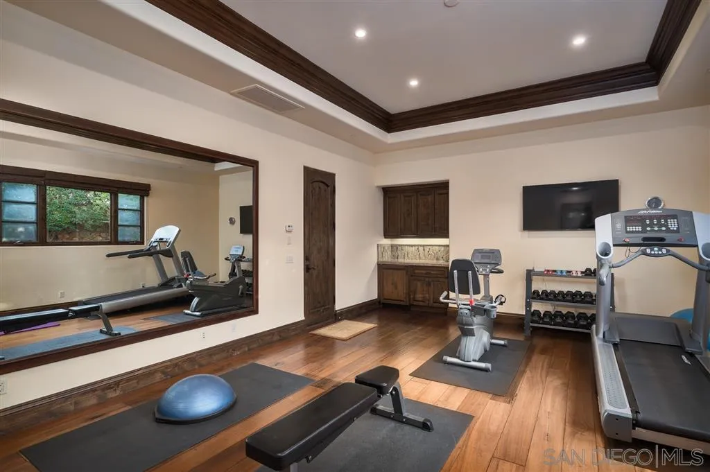6266 Strada Fragante Rancho Santa Fe, CA 92091 - Photo 20 of 25 a room with furniture gym equipment and view of living room