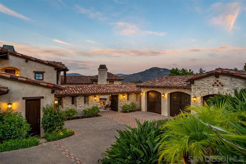6266 Strada Fragante Rancho Santa Fe, CA 92091 - Photo 4 of 25 a front view of a house with a yard and balcony