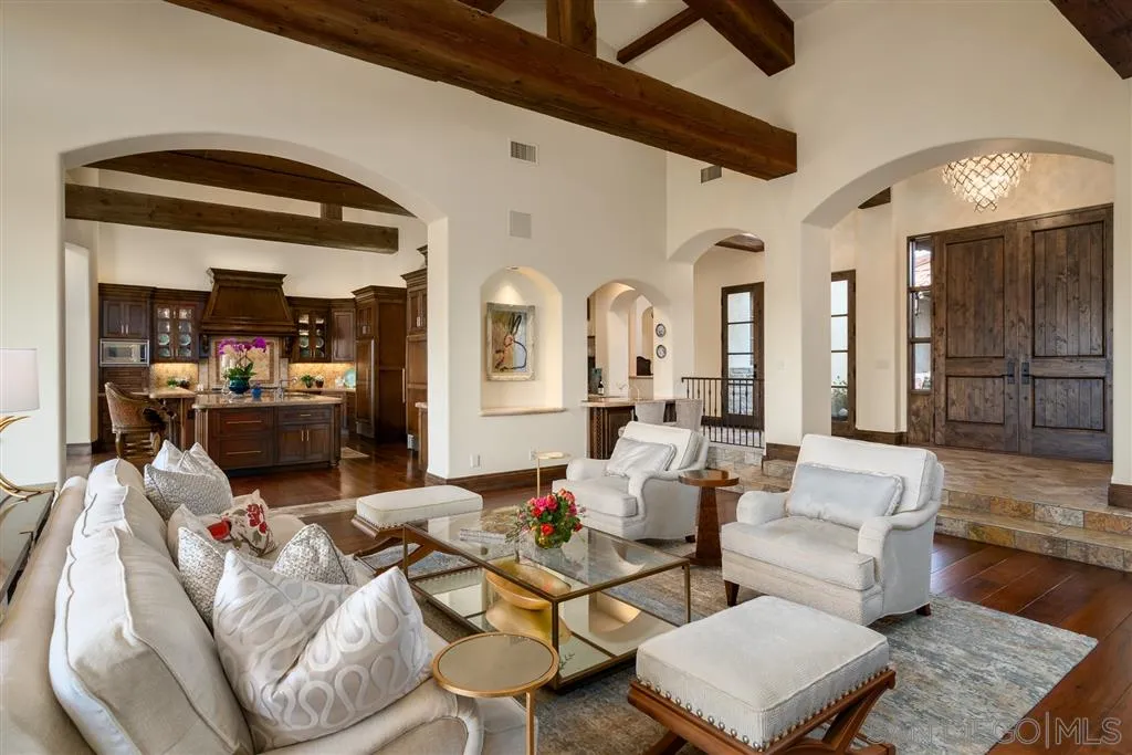 6266 Strada Fragante Rancho Santa Fe, CA 92091 - Photo 9 of 25 a living room with couches and kitchen view with wooden floor