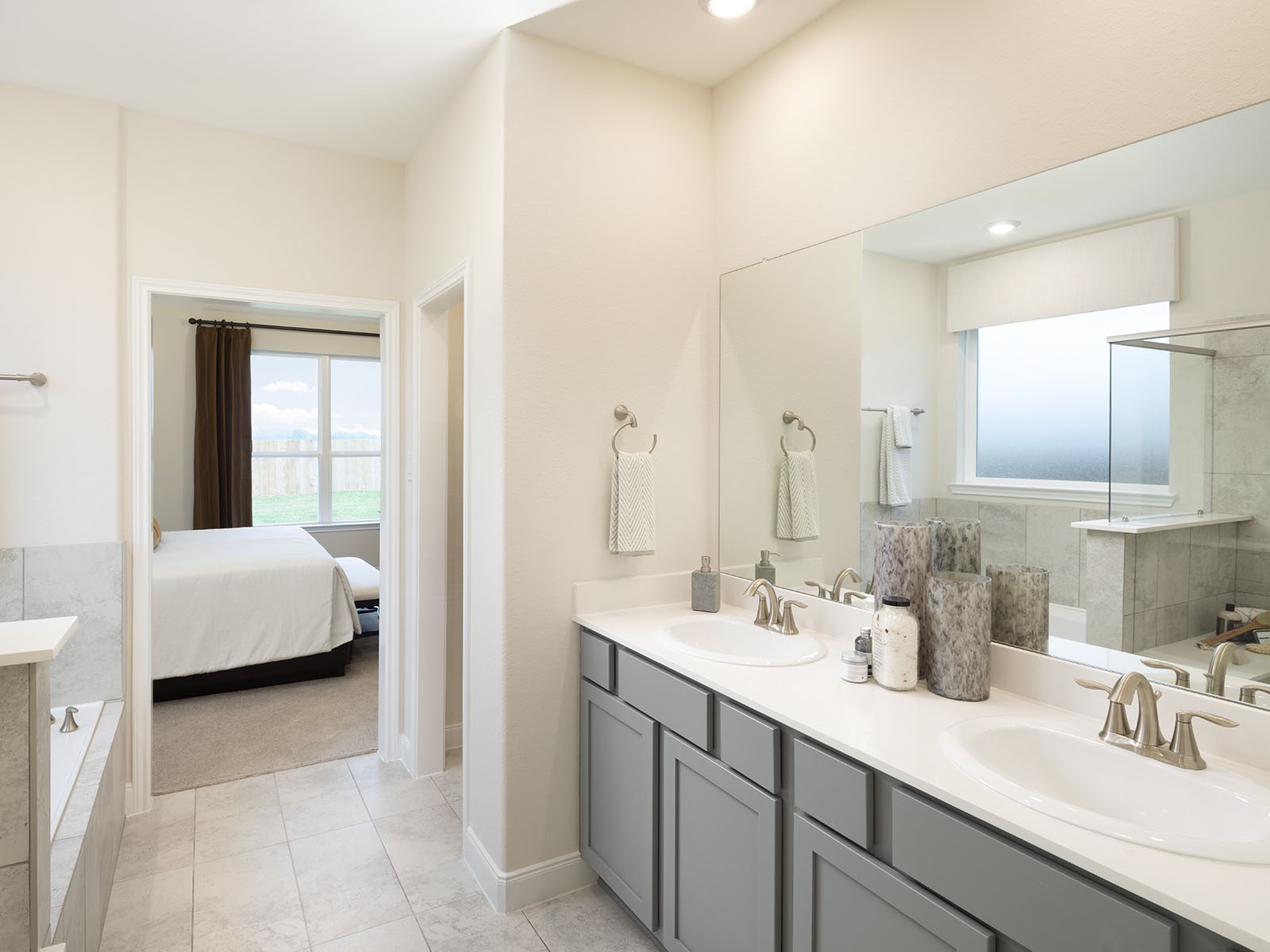 16254 Parish Pointe Court Conroe, TX 77302 - Photo 9 of 14 a en suite bathroom with a double vanity sink a mirror and a shower
