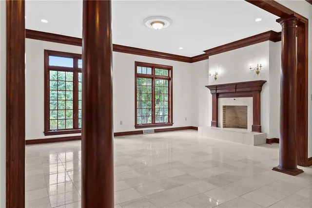 a view of staircase with railing and a chandelier