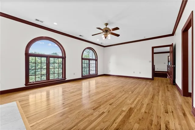 a living room with furniture and a book shelf