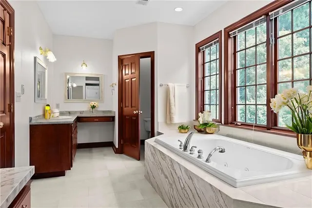 a bathroom with a bathtub and a sink
