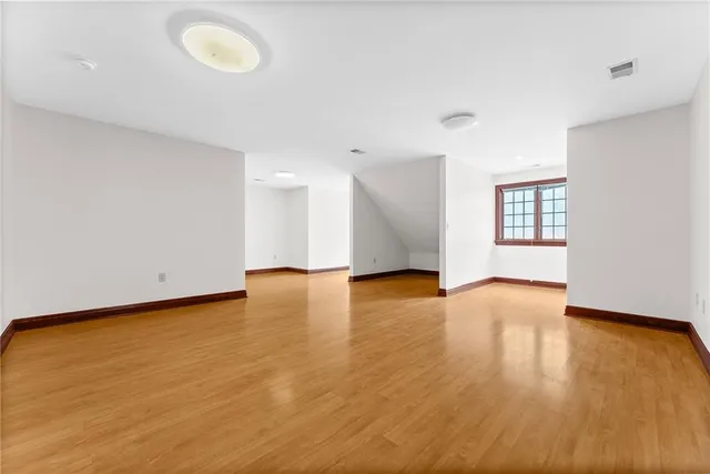 a view of room with a ceiling fan
