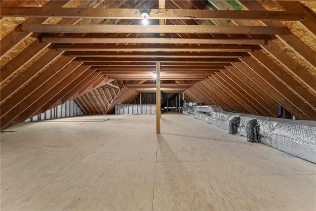 a view of a room with wooden ceiling