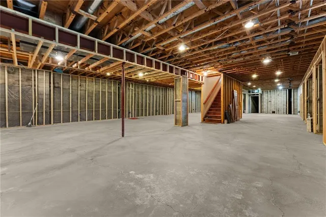 a view of empty room with wooden walls