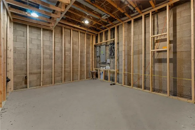 a view of a patio with table and chairs potted plants and a large tree