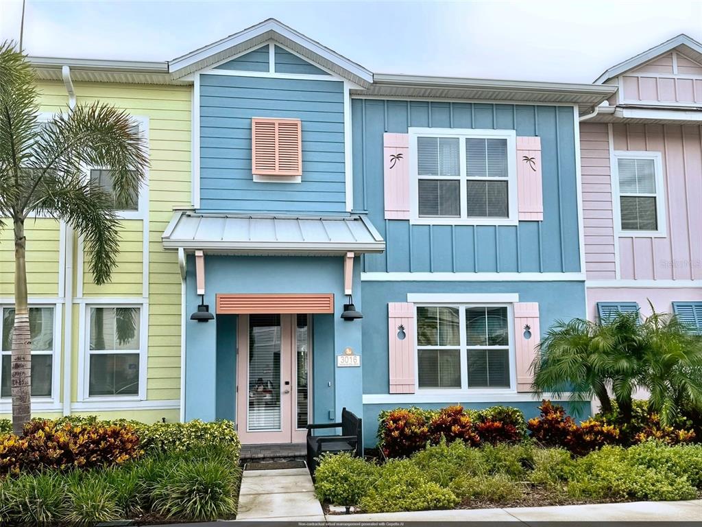 front view of a brick house with a small yard