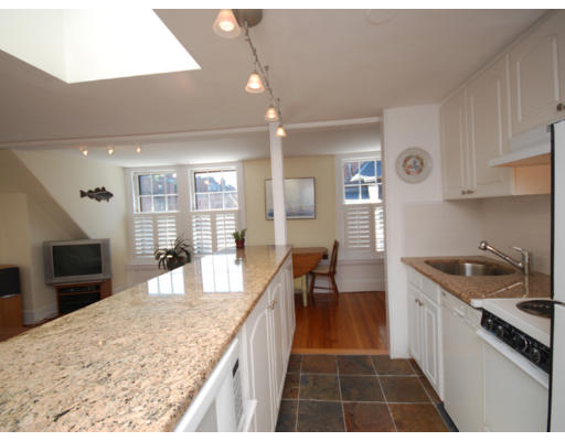 7 Fairfield Street, Unit 4 Boston, MA 02116 - Photo 4 of 13 a large kitchen with granite countertop a stove and a sink