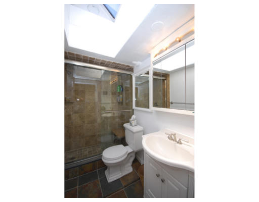 7 Fairfield Street, Unit 4 Boston, MA 02116 - Photo 9 of 13 a bathroom with a toilet a sink and a mirror