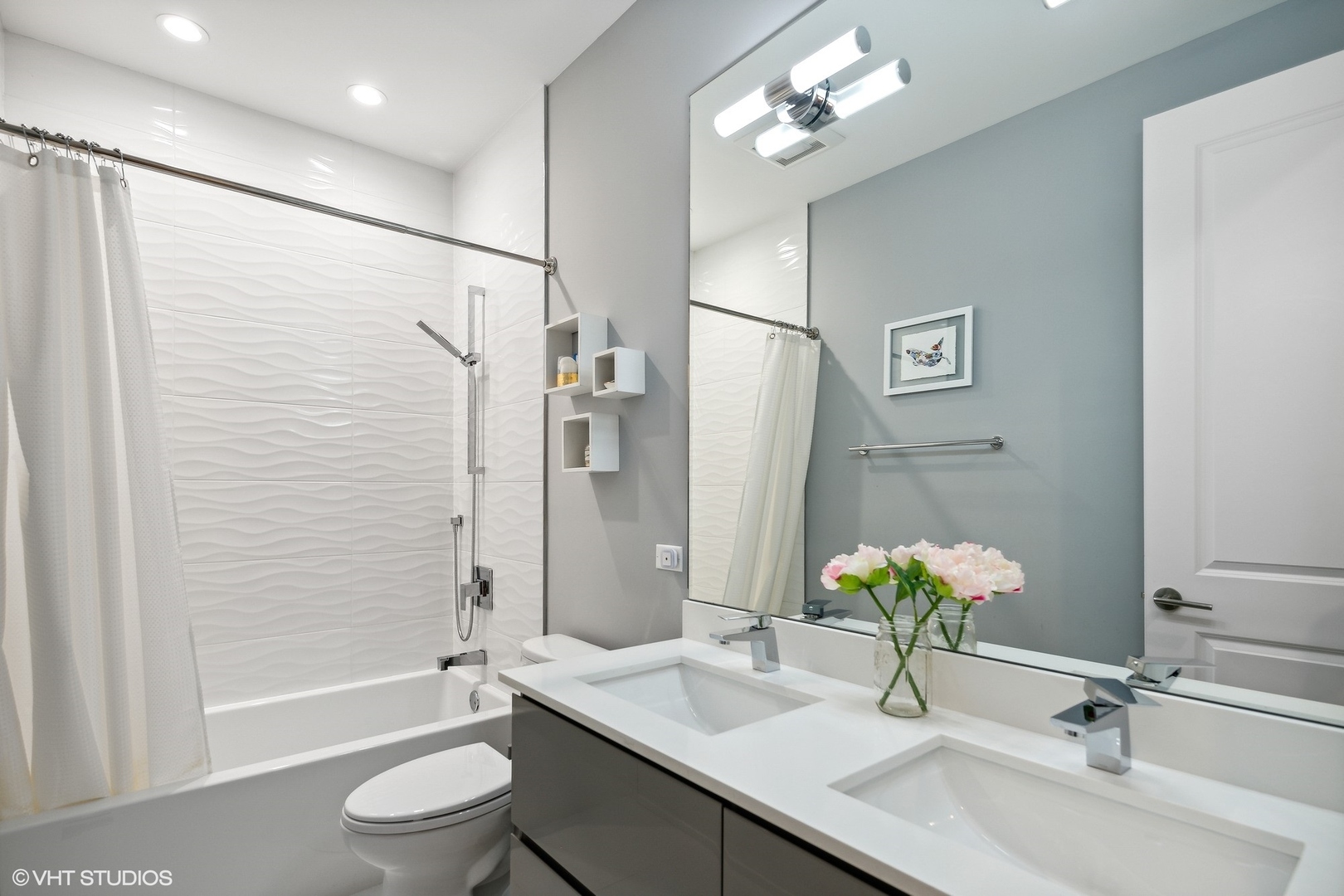 2062 North Bingham Street Chicago, IL 60647 - Photo 17 of 34 a bathroom with a granite countertop sink a toilet and shower