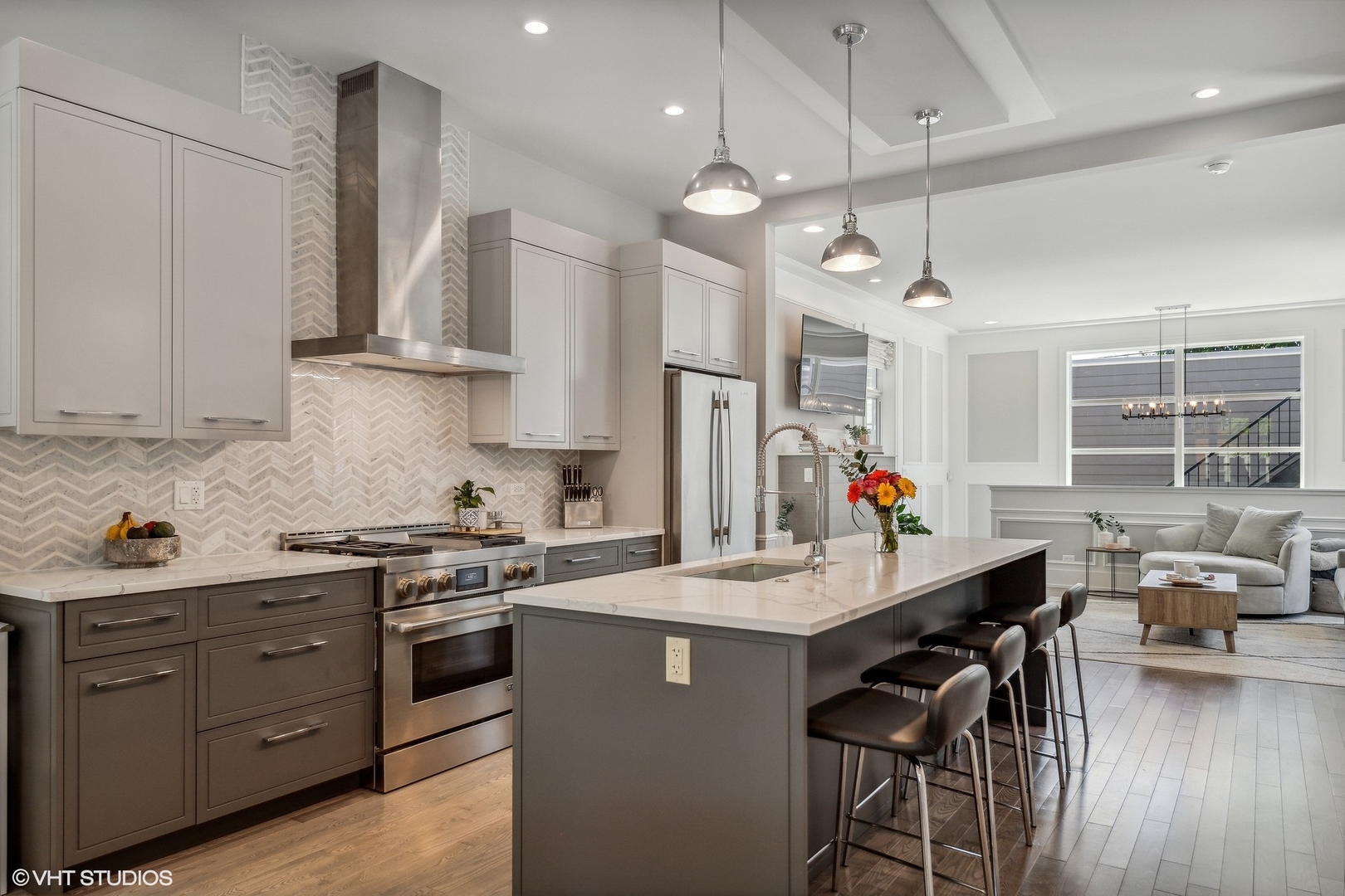 2062 North Bingham Street Chicago, IL 60647 - Photo 2 of 34 a kitchen with stainless steel appliances kitchen island granite countertop a sink cabinets and wooden floor