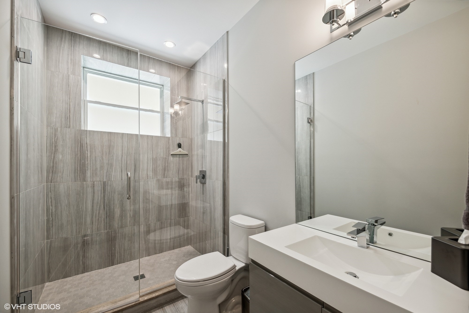 2062 North Bingham Street Chicago, IL 60647 - Photo 23 of 34 a bathroom with a sink toilet and shower