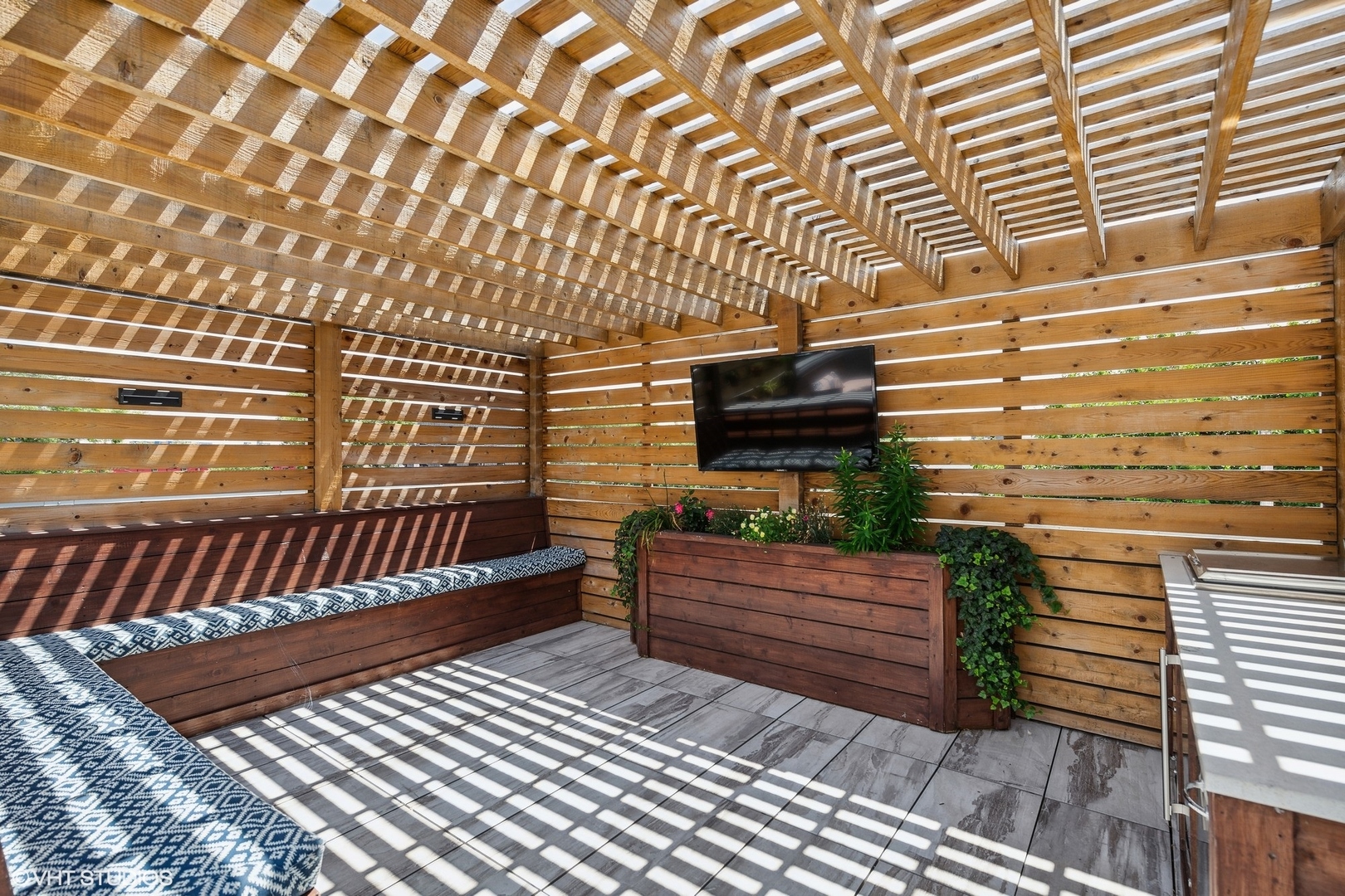 2062 North Bingham Street Chicago, IL 60647 - Photo 28 of 34 a view of a wooden bench next to a building