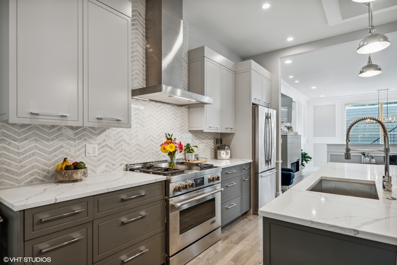 2062 North Bingham Street Chicago, IL 60647 - Photo 4 of 34 a kitchen with stainless steel appliances a sink a stove and a refrigerator