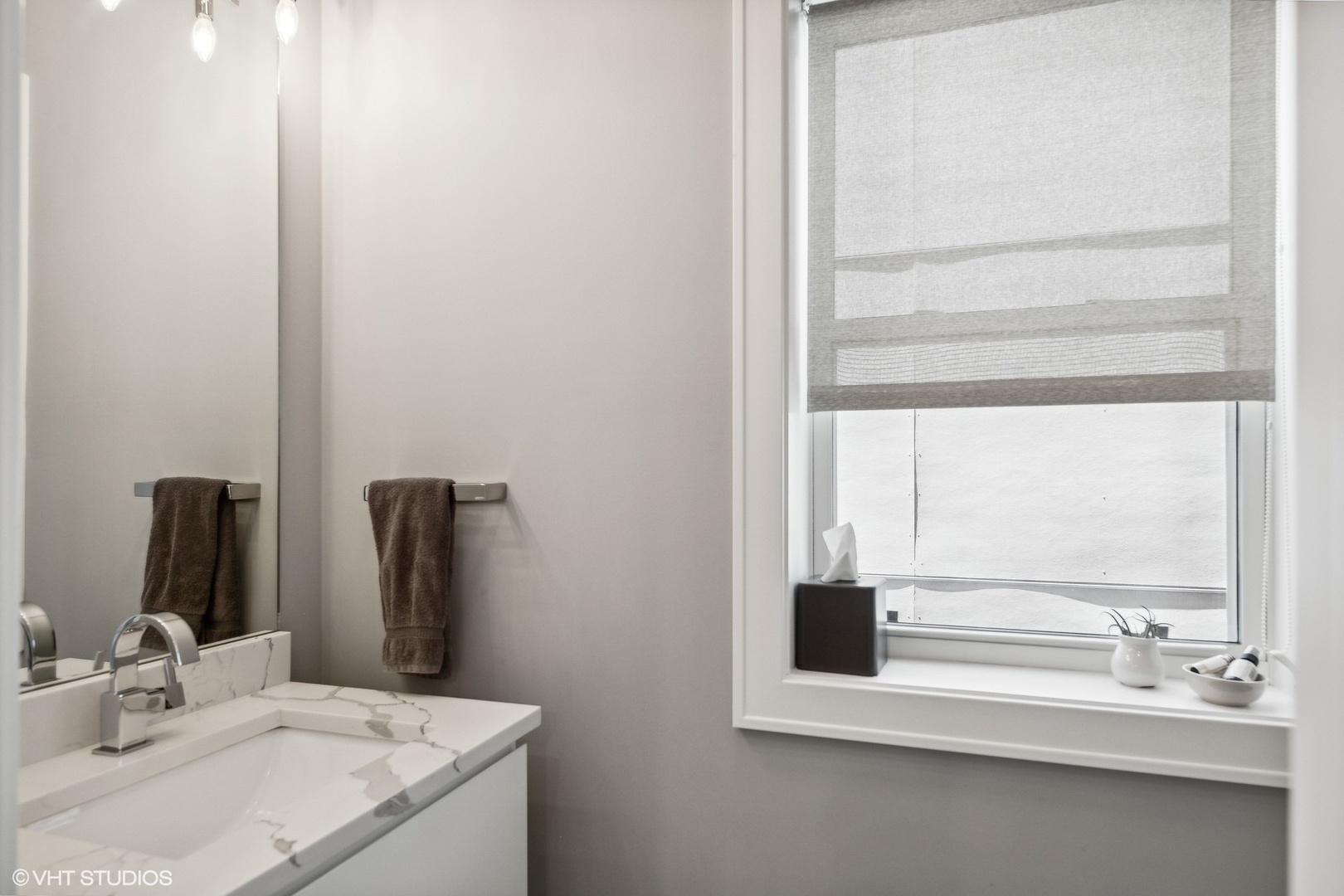 2062 North Bingham Street Chicago, IL 60647 - Photo 10 of 34 a bathroom with a sink and a mirror
