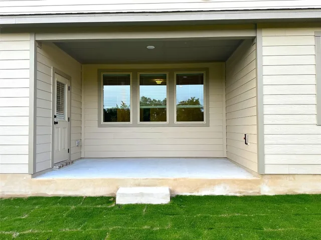 a view of yard with swimming pool and green space