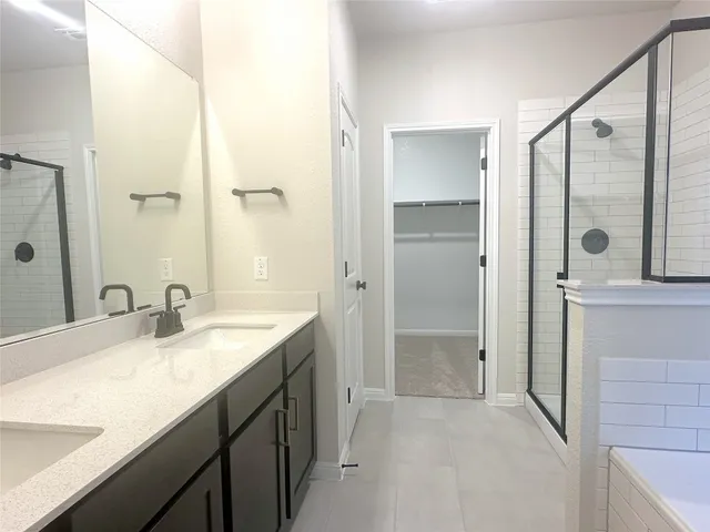 a bathroom with a bathtub and a window