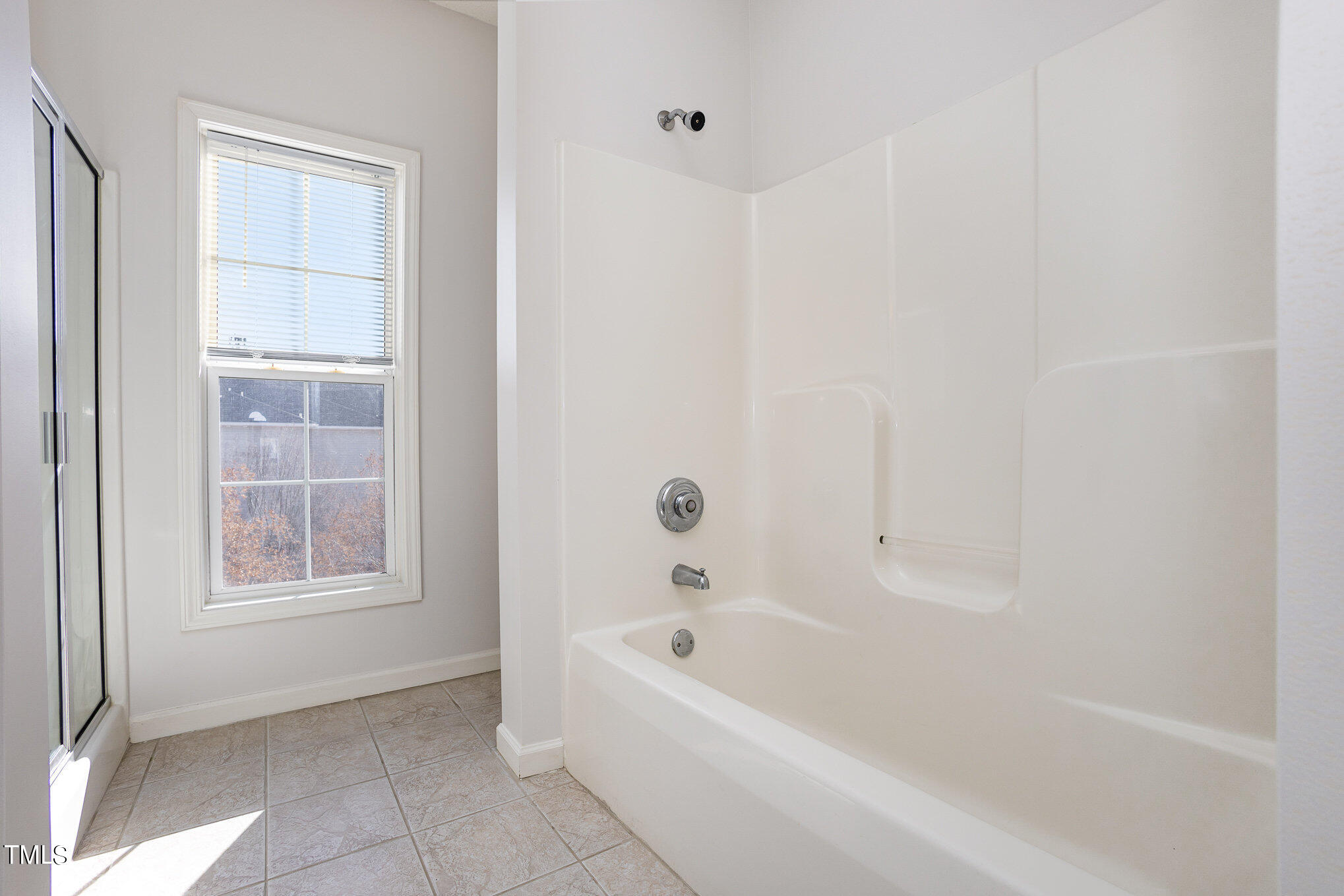 2500 Friedland Place, Unit 302 Raleigh, NC 27617 - Photo 12 of 15 a bathroom with bathtub and a shower