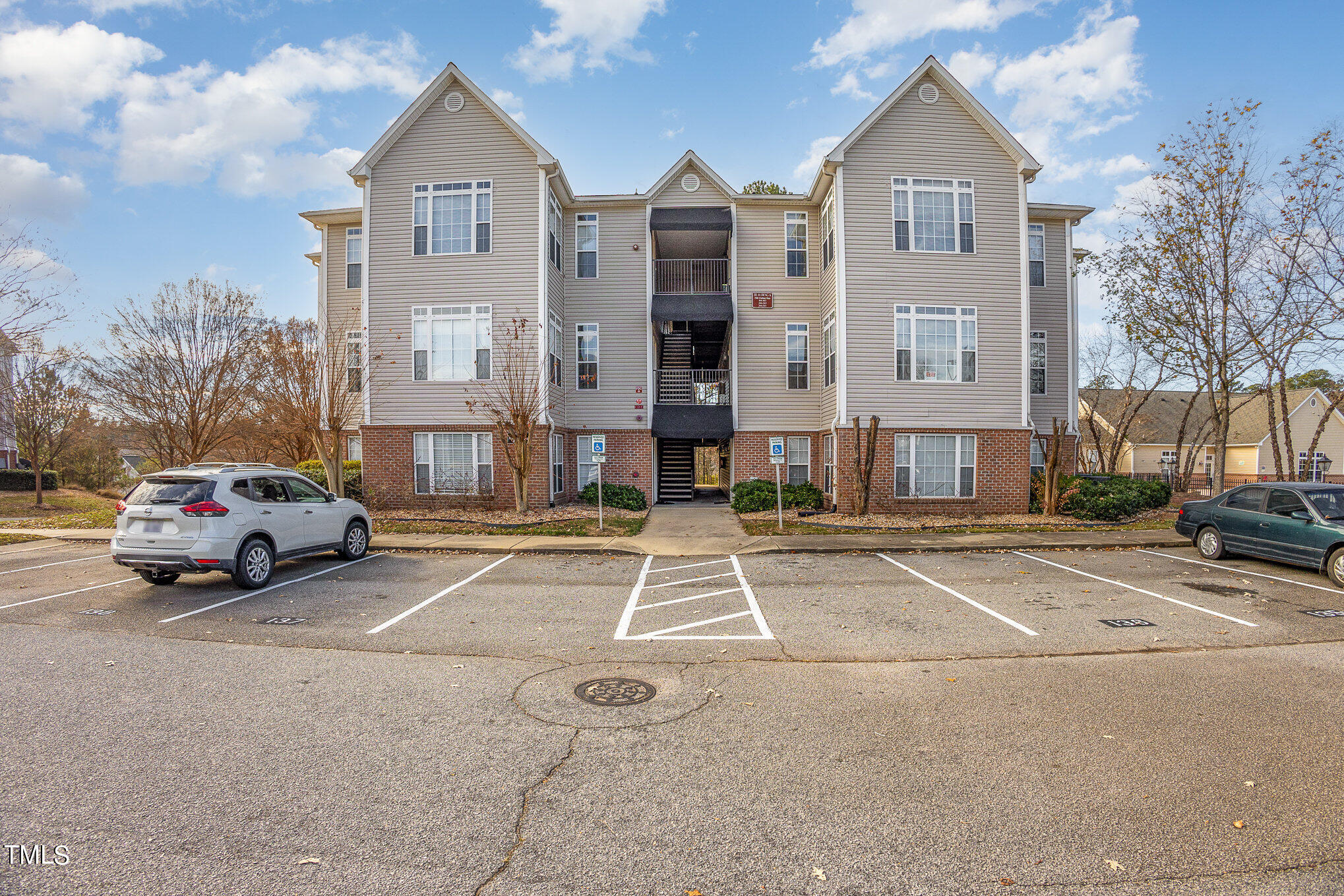 2500 Friedland Place, Unit 302 Raleigh, NC 27617 - Photo 15 of 15 a view of building with cars parked across