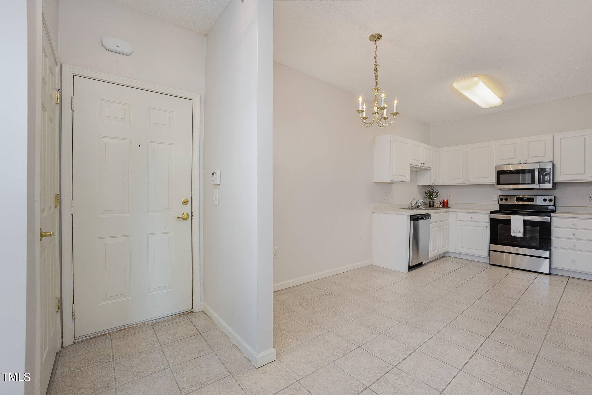 2500 Friedland Place, Unit 302 Raleigh, NC 27617 - Photo 3 of 15 a view of kitchen with sink and refrigerator