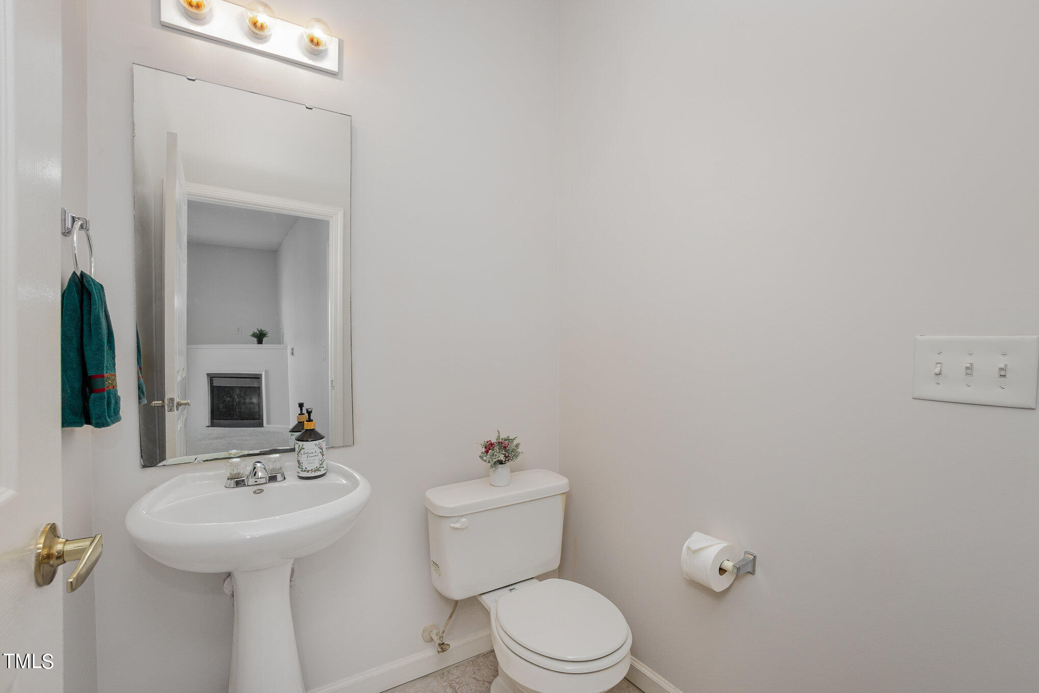 2500 Friedland Place, Unit 302 Raleigh, NC 27617 - Photo 8 of 15 a bathroom with a sink a toilet and mirror