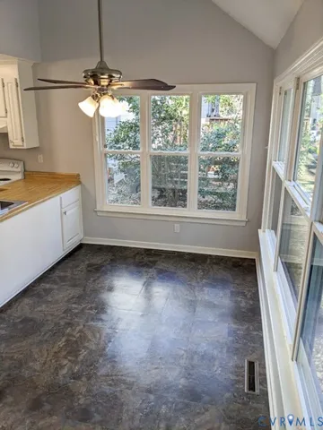 a view of an empty room with a window