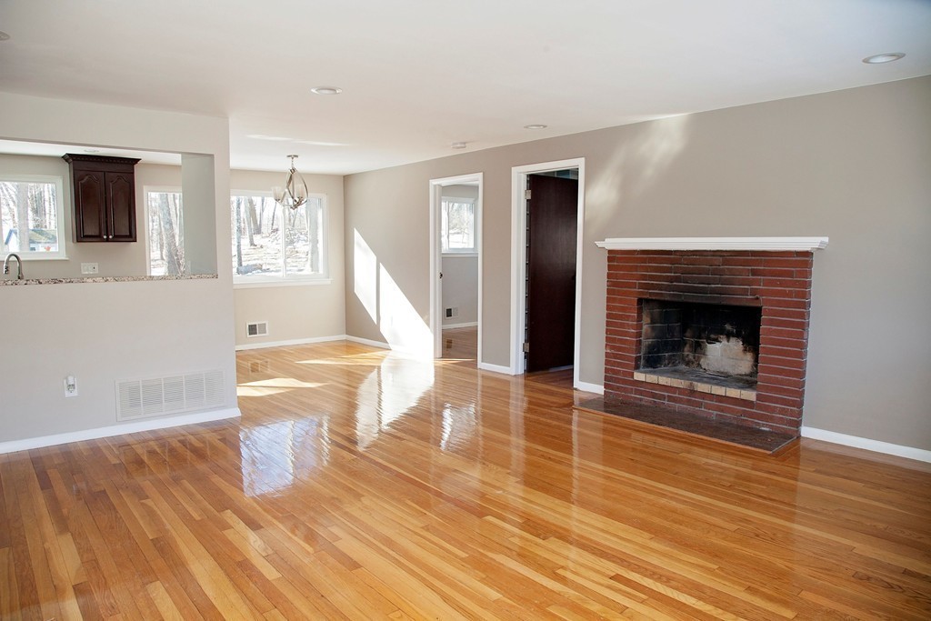 14 McAdams Road Framingham, MA 01701 - Photo 4 of 15 a living room with furniture and a fireplace