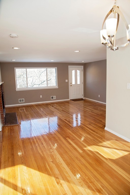 14 McAdams Road Framingham, MA 01701 - Photo 6 of 15 a view of a room with wooden floor and window